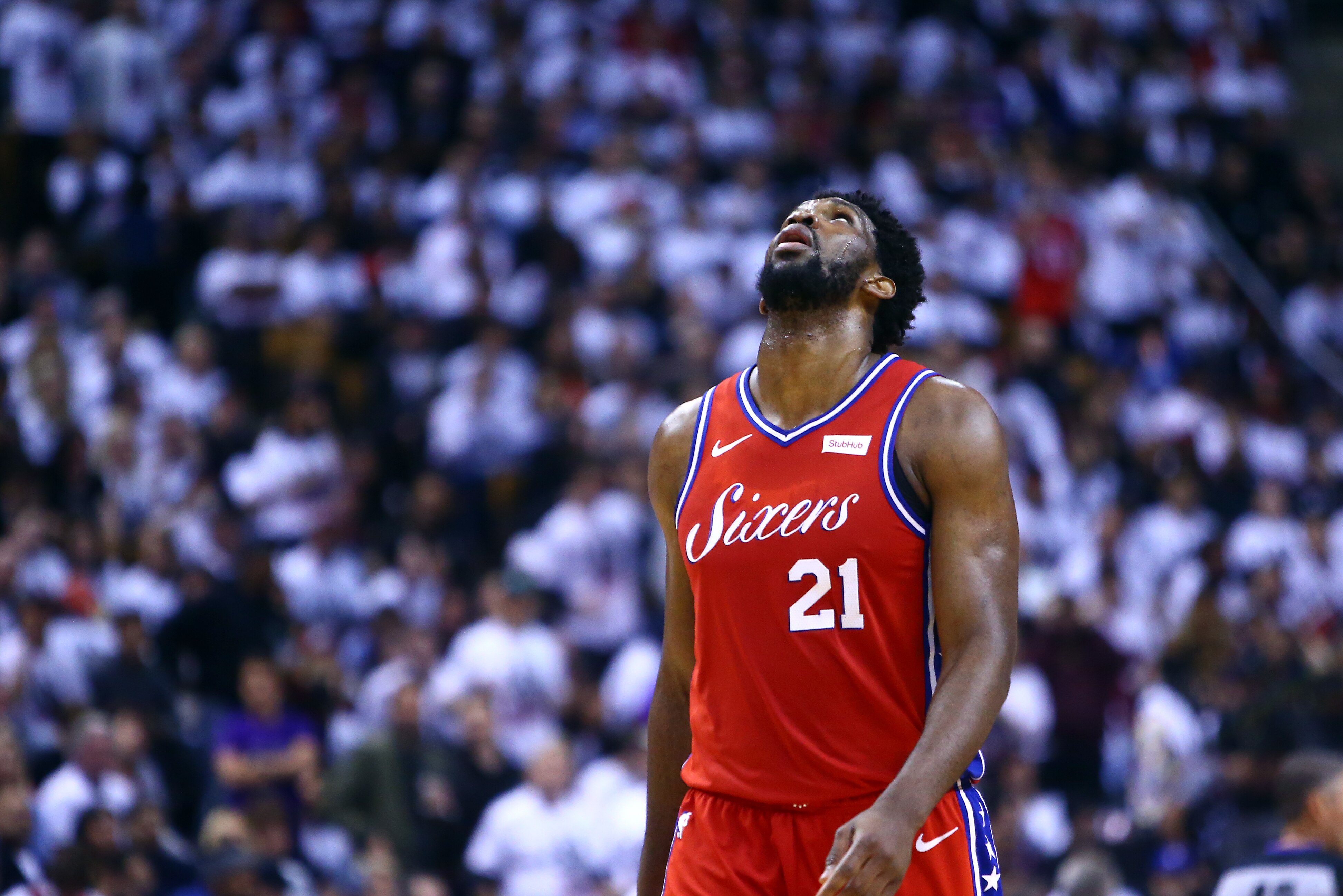 TORONTO, ON - MAY 12:  Joel Embiid #21 of the Philadelphia 76ers looks on during Game Seven of the second round of the 2019 NBA Playoffs against the Toronto Raptors at Scotiabank Arena on May 12, 2019 in Toronto, Canada.  NOTE TO USER: User expressly acknowledges and agrees that, by downloading and or using this photograph, User is consenting to the terms and conditions of the Getty Images License Agreement.  (Photo by Vaughn Ridley/Getty Images)