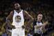 Golden State Warriors' Kevin Durant, left, walks away from referee Ken Mauer during the first half of Game 5 of the team's second-round NBA basketball playoff series against the Houston Rockets on Wednesday, May 8, 2019, in Oakland, Calif. (AP Photo/Ben Margot)