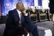 Former NBA player Patrick Ewing sits at the edge of the stage before the NBA basketball draft lottery Tuesday, May 14, 2019, in Chicago. (AP Photo/Nuccio DiNuzzo)