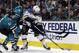 St. Louis Blues' Pat Maroon, right, moves the puck past San Jose Sharks' Justin Braun, left, and Brenden Dillon (4) during the second period in Game 2 of the NHL hockey Stanley Cup Western Conference finals, Monday, May 13, 2019, in San Jose, Calif. (AP Photo/Ben Margot)