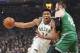 File-This May 8, 2019, file photo shows Milwaukee Bucks' Giannis Antetokounmpo driving past Boston Celtics' Aron Baynes during the first half of Game 5 of a second round NBA basketball playoff series in Milwaukee. Leading the Bucks’ resurgence is MVP candidate Antetokounmpo, a fan favorite and a source of pride for Milwaukee’s Greek community. Antetokounmpo was born in Athens, Greece.“It’s important for the Greek community to be able to gather together as a unit and celebrate him. And he in turn celebrates us,” said Tim Stasinoulias, 61, a Bucks fan since the team came to Milwaukee in 1968.(AP Photo/Morry Gash, File)