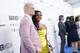 AEW vice president Cody Rhodes alongside AEW Chief Brand Officer and wife Brandi Rhodes