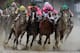 LOUISVILLE, KENTUCKY - MAY 04: Country House #20, ridden by jockey Flavien Prat, War of Will #1, ridden by jockey Tyler Gaffalione , Maximum Security #7, ridden by jockey Luis Saez and Code of Honor #13, ridden by jockey John Velazquez fight for position in the final turn during the 145th running of the Kentucky Derby at Churchill Downs on May 04, 2019 in Louisville, Kentucky. Country House #20 was declared the winner after a stewards review disqualified Maximum Security #7. (Photo by Andy Lyons/Getty Images)