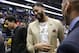 New Orleans Pelicans forward Anthony Davis, wearing a 'That's All Folks,' T-shirt under his jacket, exits the floor, possibly for the last time at a Pelican, after an NBA basketball game against the Golden State Warriors in New Orleans, Tuesday, April 9, 2019. The Warriors won 112-103. (AP Photo/Scott Threlkeld)