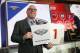 David Griffin, New Orleans Pelicans executive vice president of basketball operations, holds up placards after it was announced that the Pelicans had won the first pick during the NBA basketball draft lottery Tuesday, May 14, 2019, in Chicago. (AP Photo/Nuccio DiNuzzo)