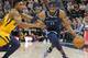 Memphis Grizzlies guard Mike Conley (11) drives around Utah Jazz guard Donovan Mitchell, left, in the first half of an NBA basketball game Monday, Oct. 22, 2018, in Salt Lake City. (AP Photo/Rick Bowmer)
