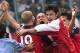 Bayern Muinch's Patrik Andersson, center, cries in triumph as he celebrates with his teammates, not identified, after he scored the decisive goal of the 1-1 tie during the soccer match versus Hamburger SV in Hamburg, northern Germany on Saturday, May 19, 2001. With this 1-1 draw, Bayern Muinch won the championship of the German first division soccer league. (AP Photo/Heribert Proepper)