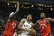 Milwaukee Bucks' Giannis Antetokounmpo, middle, drives to the basket between Toronto Raptors' Pascal Siakam (43) and Serge Ibaka (9) during the second half of an NBA basketball game, Saturday, Jan. 5, 2019, in Milwaukee. The Raptors won 123-116. (AP Photo/Aaron Gash)
