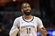 Memphis Grizzlies guard Mike Conley (11) stands on the court in the first half of an NBA basketball game against the Golden State Warriors Wednesday, March 27, 2019, in Memphis, Tenn. Conley passed Marc Gasol as the franchise's all-time scorer during the game. (AP Photo/Brandon Dill)