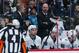 San Jose Sharks head coach Peter DeBoer, back, looks on against the Colorado Avalanche in the second period of Game 6 of an NHL hockey second-round playoff series, Monday, May 6, 2019, in Denver. (AP Photo/Jack Dempsey)