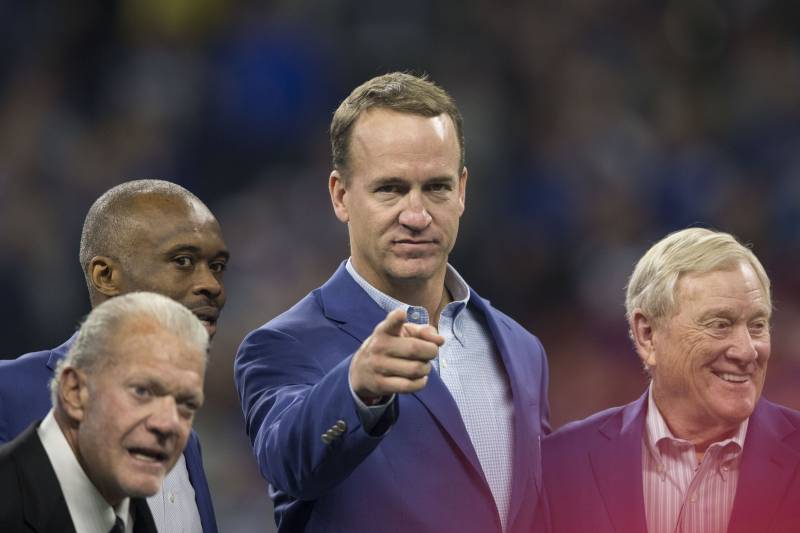 Indianapolis Colts quarterback Peyton Manning as former Colts wide receiver Reggie Wayne is inducted during a Colts Ring of Honor ceremony during the halftime of an NFL football game between the Indianapolis Colts and the Tennessee Titans, Sunday, Nov. 18, 2018, in Indianapolis. (AP Photo/AJ Mast)