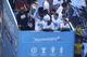 Manchester City's Belgian defender Vincent Kompany and Manchester City's English defender John Stones hold up the Premier League trophy to the team's fans as they take part in an open-top bus parade through Manchester, northern England on May 20, 2019, to celebrate winning the 2019 Premier League title, the FA Cup and English League Cup. - Pep Guardiola saluted Manchester City's history makers after they clinched the domestic treble with a swaggering 6-0 rout of Watford in the FA Cup final on Saturday. Just a week after winning a second successive Premier League crown, City's record-equalling FA Cup final victory made them the first English club to win the English title, FA Cup and League Cup in the same season. (Photo by Oli SCARFF / AFP) (Photo credit should read OLI SCARFF/AFP/Getty Images)