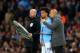 MANCHESTER, ENGLAND - MAY 06: Josep Guardiola, Manager of Manchester City talks to subtitute Leroy Sane during the Premier League match between Manchester City and Leicester City at Etihad Stadium on May 06, 2019 in Manchester, United Kingdom. (Photo by Michael Regan/Getty Images)
