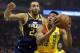 Milwaukee Bucks' Giannis Antetokounmpo, right, shoots past Utah Jazz's Rudy Gobert during the first half of an NBA basketball game Monday, Jan. 7, 2019, in Milwaukee. (AP Photo/Aaron Gash)