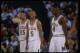 8 Mar 1992: Michigan Wolverines forward Juwan Howard, guard Jalen Rose, and forward Chris Webber (l to r) look on during a game against the Indiana Pacers.