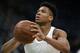 Milwaukee Bucks' Giannis Antetokounmpo warms up before Game 3 of a second round NBA basketball playoff series against the Boston Celtics in Boston, Friday, May 3, 2019. (AP Photo/Michael Dwyer)