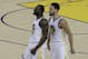 Golden State Warriors forward Draymond Green, left, celebrates with guard Klay Thompson during the second half of Game 1 of the team's NBA basketball playoffs Western Conference finals against the Portland Trail Blazers in Oakland, Calif., Tuesday, May 14, 2019. (AP Photo/Jeff Chiu)