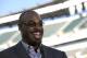 Former Philadelphia Eagles quarterback Donovan McNabb laughs during an interview before an NFL football game between the Philadelphia Eagles and the Kansas City Chiefs, Thursday, Sept. 19, 2013, in Philadelphia. McNabb is scheduled to have his jersey retired at halftime. (AP Photo/Michael Perez)