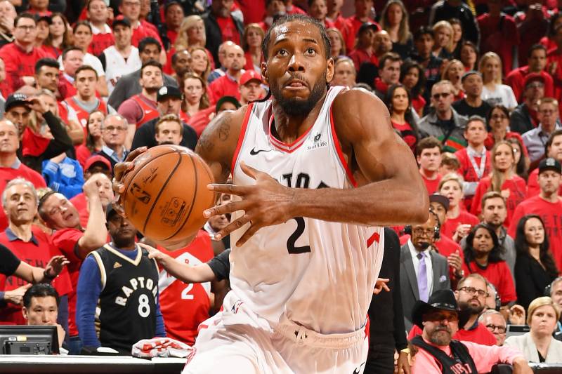 TORONTO, CANADA - MAY 25: Kawhi Leonard #2 of the Toronto Raptors drives through the paint during the game against the Milwaukee Bucks during Game Six of the Eastern Conference Finals on May 25, 2019 at Scotiabank Arena in Toronto, Ontario, Canada. NOTE TO USER: User expressly acknowledges and agrees that, by downloading and/or using this photograph, user is consenting to the terms and conditions of the Getty Images License Agreement. Mandatory Copyright Notice: Copyright 2019 NBAE (Photo by Ron Turenne/NBAE via Getty Images)