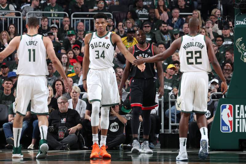 MILWAUKEE, WI - MAY 17: Giannis Antetokounmpo #34 and Khris Middleton #22 of the Milwaukee Bucks high five during Game Two of the Eastern Conference Finals against the Toronto Raptors on May 17, 2019 at the Fiserv Forum in Milwaukee, Wisconsin. NOTE TO USER: User expressly acknowledges and agrees that, by downloading and/or using this photograph, user is consenting to the terms and conditions of the Getty Images License Agreement. Mandatory Copyright Notice: Copyright 2019 NBAE (Photo by Nathaniel S. Butler/NBAE via Getty Images)