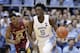 North Carolina's Nassir Little (5) dribbles while Florida State's M.J. Walker (23) chases during the first half of an NCAA college basketball game in Chapel Hill, N.C., Saturday, Feb. 23, 2019. (AP Photo/Gerry Broome)