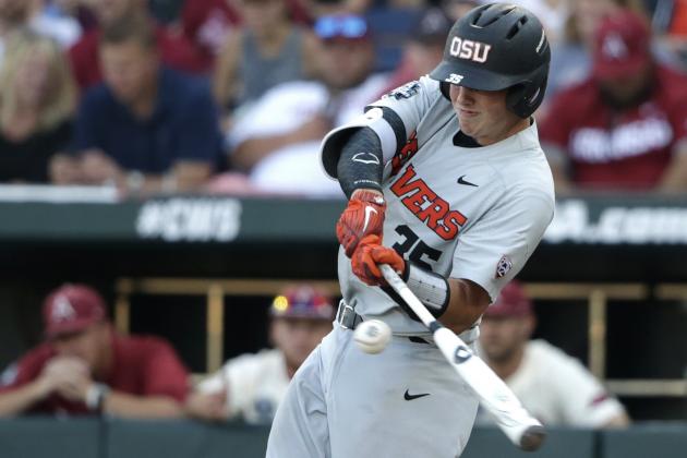 Oregon State's Adley Rutschman singles against Arkansas during the fifth inning of Game 3 of the NCAA College World Series baseball finals, Thursday, June 28, 2018, in Omaha, Neb. (AP Photo/Nati Harnik)