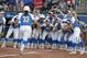 UCLA's Brianna Tautalafua (33) is greeted by teammates after a home run in the sixth inning against Oklahoma during the first game of the best-of-three championship series in the NCAA softball Women's College World Series in Oklahoma City, Monday, June 3, 2019. (AP Photo/Alonzo Adams)