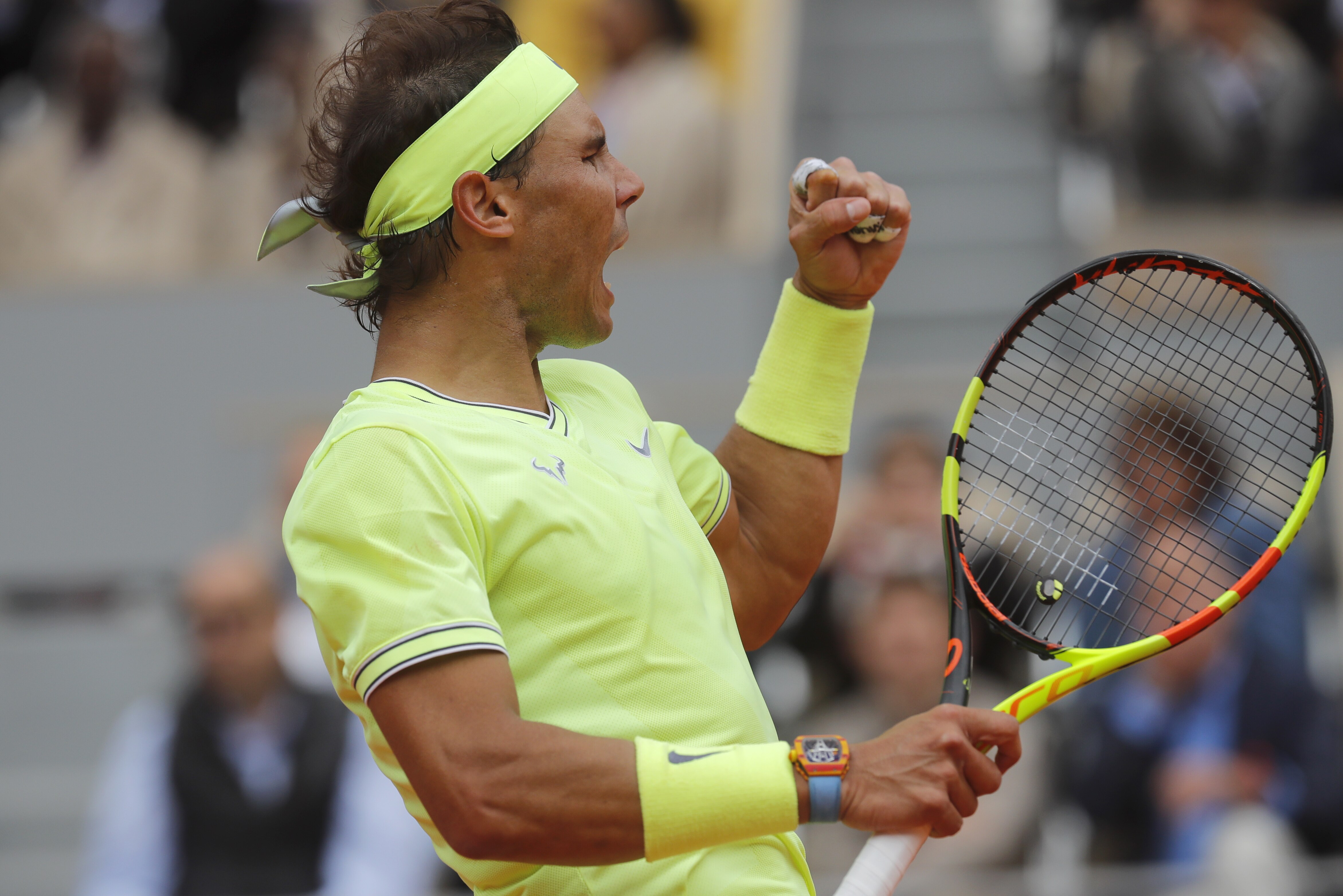 Spain's Rafael Nadal clenches his fist after scoring a point against Switzerland's Roger Federer during their semifinal match of the French Open tennis tournament at the Roland Garros stadium in Paris, Friday, June 7, 2019. (AP Photo/Michel Euler)