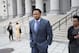 Former Oklahoma State assistant basketball coach Lamont Evans leaves after his sentencing in Federal Court June 7, 2019, in New York. Evans is one of four convicted in a scheme to pay coaches and families of top-tier players to choose favored managers and financial advisors. (AP Photo/Kevin Hagen)