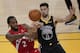 Toronto Raptors forward Kawhi Leonard (2) passes the ball in front of Golden State Warriors guard Klay Thompson (11) during the second half of Game 4 of basketball's NBA Finals in Oakland, Calif., Friday, June 7, 2019. (AP Photo/Tony Avelar)