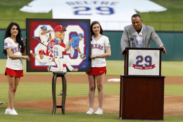 Retired baseball player Adrian Beltre, right, speaks during a ceremony where his Texas Rangers jersey was retired before the second baseball game of a doubleheader against the Oakland Athletics in Arlington, Texas, Saturday, June 8, 2019. (AP Photo/Tony Gutierrez)