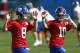 New York Giants quarterbacks Eli Manning (10) and Daniel Jones (8) warm up during an NFL football practice Monday, May 20, 2019, in East Rutherford, N.J. (AP Photo/Adam Hunger)