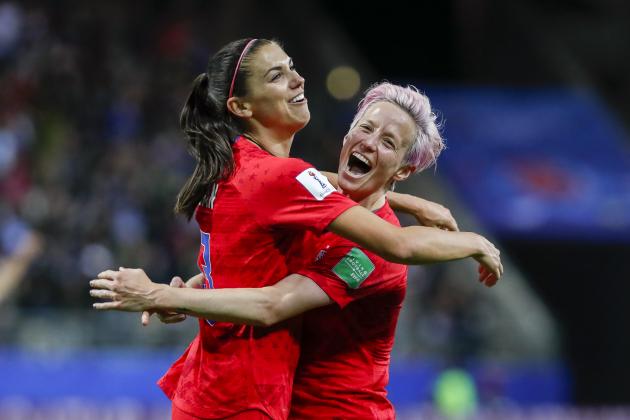REIMS, FRANCE - JUNE 11: Alex Morgan #13 of USA celebrates her fifth goal with Megan Rapinoe #15 of USA during the 2019 FIFA Women's World Cup France group F match between USA and Thailand at Stade Auguste Delaune on June 11, 2019 in Reims, France. (Photo by Catherine Steenkeste/Getty Images)