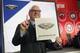 David Griffin, Executive Vice President of basketball operations for the New Orleans Pelicans holds up a placard after it was announced that his team had won the first pick during the NBA basketball draft lottery Tuesday, May 14, 2019, in Chicago. (AP Photo/Nuccio DiNuzzo)