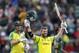 Australia's David Warner, right, celebrates after getting 100 runs not out during the Cricket World Cup match between Australia and Pakistan at the County Ground in Taunton, south west England, Wednesday, June 12, 2019. (AP Photo/Alastair Grant)