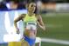 Gabriele Grunewald runs in the women's 1500 meters at the U.S. Track and Field Championships, Thursday, June 22, 2017, in Sacramento, Calif. Grunewald is two weeks into chemotherapy to treat cancer that's gone from her salivary gland to her liver. (AP Photo/Rich Pedroncelli)