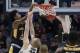 Murray State's Ja Morant, left, dunks over Marquette's Joey Hauser (22) during the second half of a first round men's college basketball game in the NCAA Tournament, Thursday, March 21, 2019, in Hartford, Conn. (AP Photo/Elise Amendola)