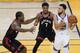 Golden State Warriors guard Stephen Curry , right, is defended by Toronto Raptors forward Kawhi Leonard, left, and guard Kyle Lowry (7) during the first half of Game 3 of basketball's NBA Finals in Oakland, Calif., Wednesday, June 5, 2019. (AP Photo/Tony Avelar)