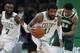Boston Celtics' Kyrie Irving (11) brings the ball up court during the second half of Game 4 of a second round NBA basketball playoff series against the Milwaukee Bucks in Boston, Monday, May 6, 2019. (AP Photo/Michael Dwyer)