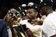 OAKLAND, CALIFORNIA - JUNE 13: Kawhi Leonard #2 of the Toronto Raptors celebrates with the Larry O'Brien Championship Trophy after his team defeated the Golden State Warriors to win Game Six of the 2019 NBA Finals at ORACLE Arena on June 13, 2019 in Oakland, California. NOTE TO USER: User expressly acknowledges and agrees that, by downloading and or using this photograph, User is consenting to the terms and conditions of the Getty Images License Agreement. (Photo by Ezra Shaw/Getty Images)