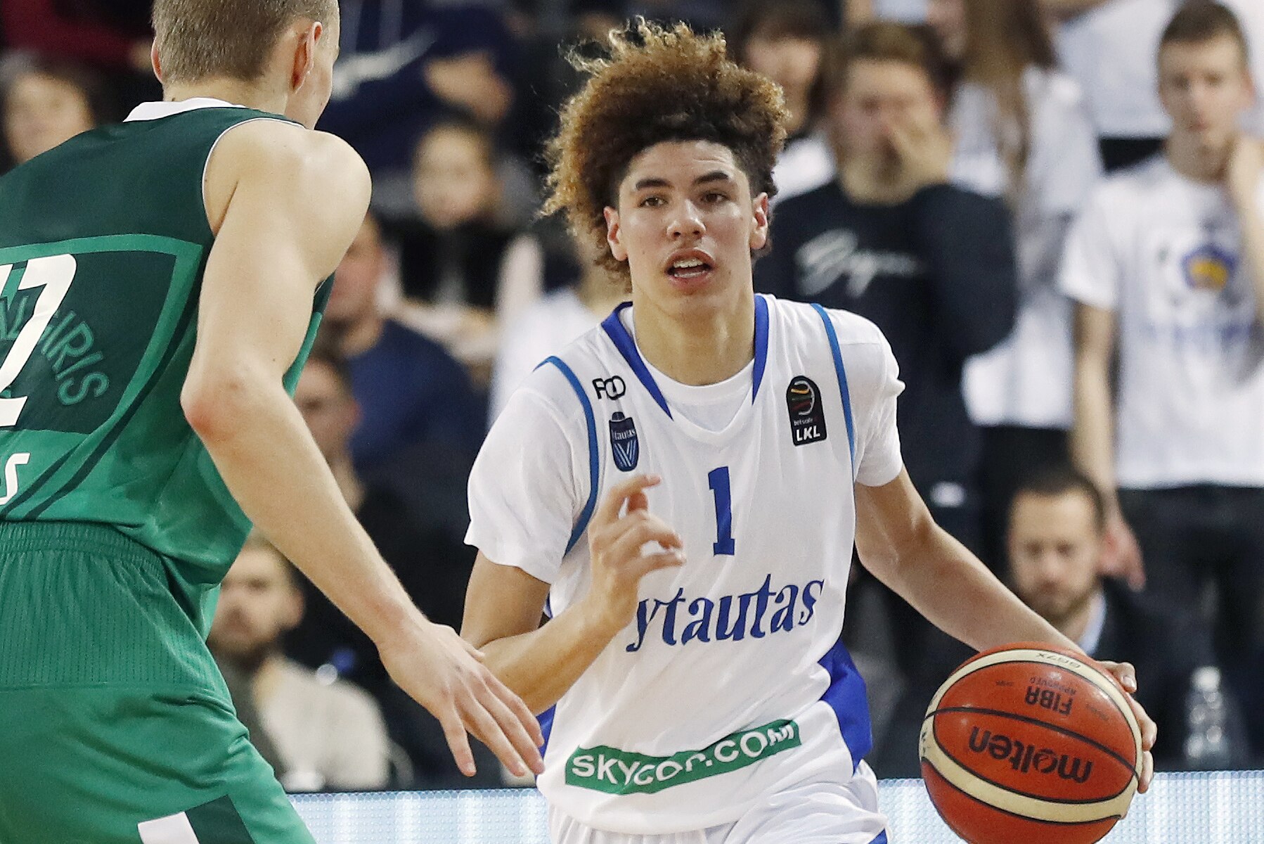 BC Prienu Vytautas's LaMelo Ball in action during the Big Baller Brand Challenge friendly tournament match between BC Prienu Vytautas and BC Zalgiris-2 at the BC Prienai-Birstonas Vytautas arena, in Prienai, Lithuania, Tuesday, Jan. 9, 2018. LiAngelo Ball and LaMelo Ball, sons of former basketball player LaVar Ball, have signed a one-year contract and play their first match for Lithuanian professional basketball club Prienu Vytautas. (AP Photo/Liusjenas Kulbis)