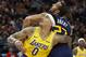 Utah Jazz center Rudy Gobert (27) and Los Angeles Lakers forward Kyle Kuzma (0) battle for position under the basket during the second half of an NBA basketball game Wednesday, March 27, 2019, in Salt Lake City. (AP Photo/Rick Bowmer)