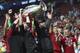 Liverpool's coach Juergen Klopp, center, celebrate with his teammates after winning the Champions League final soccer match between Tottenham Hotspur and Liverpool at the Wanda Metropolitano Stadium in Madrid, Saturday, June 1, 2019. (AP Photo/Francisco Seco)