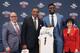 New Orleans Pelicans first-round draft pick Zion Williamson, second from right, poses with, left to right, Pelicans executive vice president of basketball operations David Griffin, coach Alvin Gentry, and team owner Gayle Benson, at his introductory news conference at the NBA basketball team's practice facility in Metairie, La., Friday, June 21, 2019. (AP Photo/Gerald Herbert)