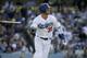 Los Angeles Dodgers' Cody Bellinger watches his solo home run against the Chicago Cubs during the sixth inning of a baseball game in Los Angeles, Sunday, June 16, 2019. (AP Photo/Alex Gallardo)