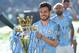 Manchester City's Spanish midfielder David Silva poses with the Premier League trophy after their 4-1 victory in the English Premier League football match between Brighton and Hove Albion and Manchester City at the American Express Community Stadium in Brighton, southern England on May 12, 2019. - Manchester City held off a titanic challenge from Liverpool to become the first side in a decade to retain the Premier League on Sunday by coming from behind to beat Brighton 4-1 on Sunday. (Photo by Glyn KIRK / AFP) / RESTRICTED TO EDITORIAL USE. No use with unauthorized audio, video, data, fixture lists, club/league logos or 'live' services. Online in-match use limited to 120 images. An additional 40 images may be used in extra time. No video emulation. Social media in-match use limited to 120 images. An additional 40 images may be used in extra time. No use in betting publications, games or single club/league/player publications. / (Photo credit should read GLYN KIRK/AFP/Getty Images)