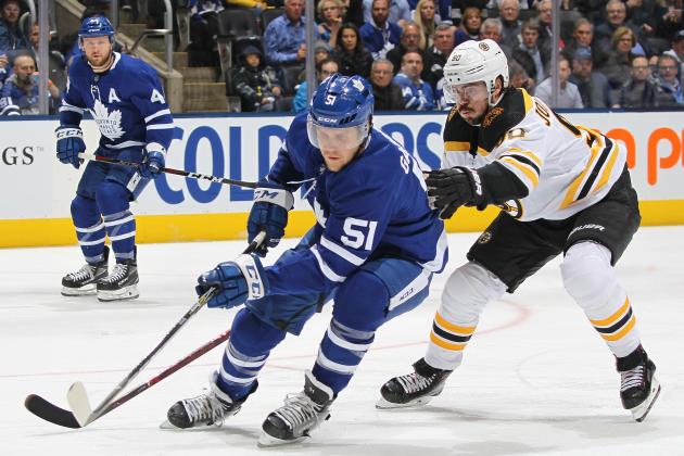 TORONTO, ON - APRIL 17: Marcus Johansson #90 of the Boston Bruins skates to check Jake Gardiner #51 of the Toronto Maple Leafs in Game Four of the Eastern Conference First Round during the 2019 NHL Stanley Cup Playoffs at Scotiabank Arena on April 17, 2019 in Toronto, Ontario, Canada. (Photo by Claus Andersen/Getty Images)
