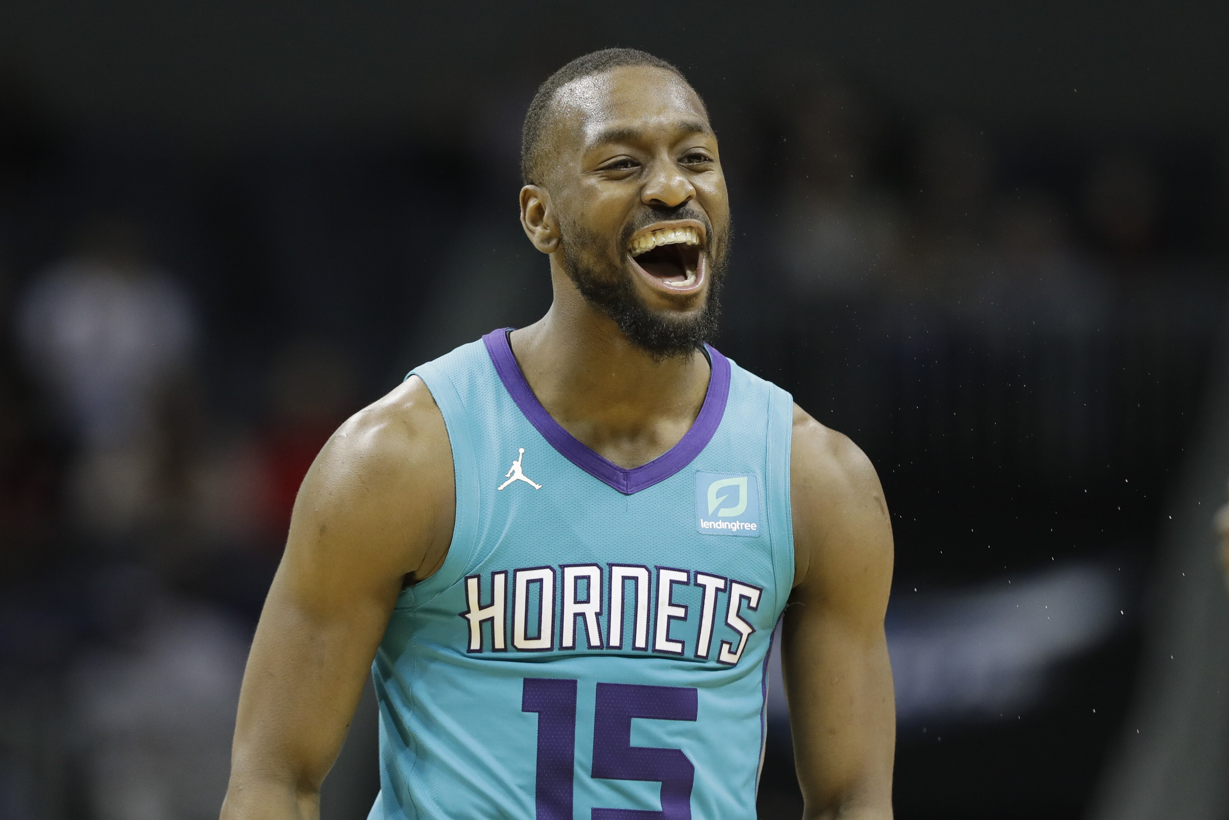 Charlotte Hornets guard Kemba Walker (15) reacts after a basket against the Washington Wizards during the second half of an NBA basketball game in Charlotte, N.C., Friday, Feb. 22, 2019. (AP Photo/Chuck Burton)
