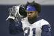 Dallas Cowboys running back Ezekiel Elliott (21) walks the field during an organized team activity at its NFL football training facility in Frisco, Texas, Wednesday, May 29, 2019. (AP Photo/Ron Jenkins)
