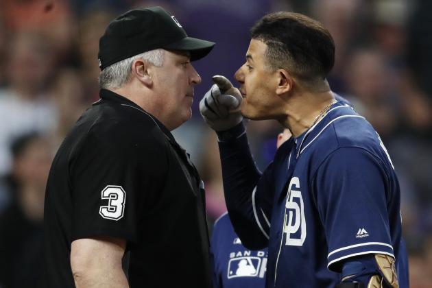 San Diego Padres shortstop Manny Machado, right, yells at home plate umpire Bill Welke, who had called Machado out on strikes during the fifth inning of the team's baseball game against the Colorado Rockies on Saturday, June 15, 2019, in Denver. (AP Photo/David Zalubowski)